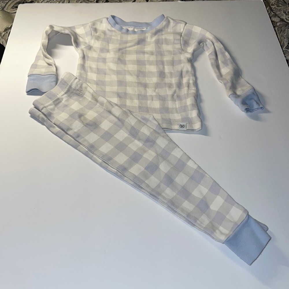 The Honest Company 18 month pajama set blue and white check small stain on pant.
